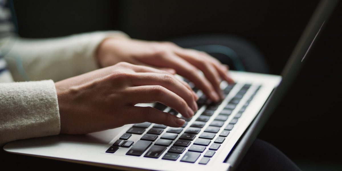 typing on laptop
